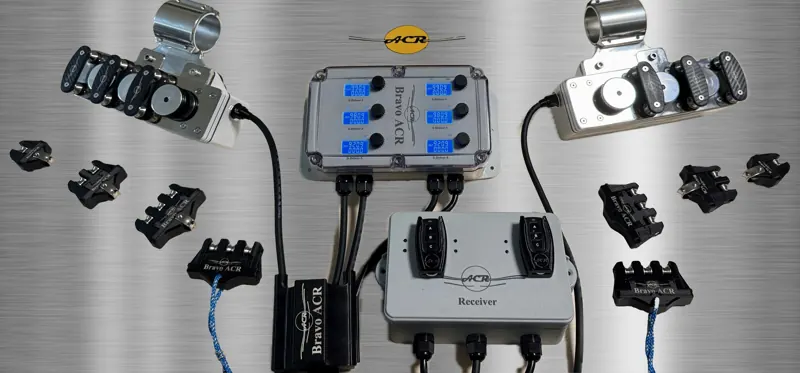 Bravo ACR components on brushed metal: boxes, handheld fobs, and motor and pulley units with pole clamps