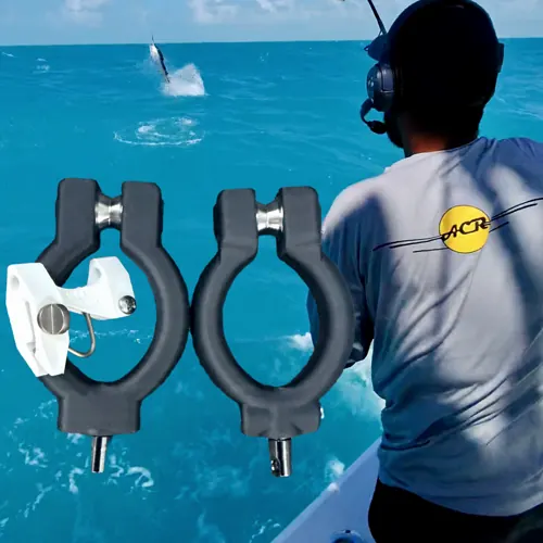 Kite fishing with Bravo ACR: a fish jumps behind the boat as an angler in a Bravo ACR shirt watches, with two clamp-on kite pulleys in front