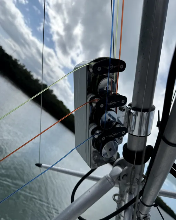 Bravo ACR unit clamped to an outrigger pole, colored halyards running up through its pulleys